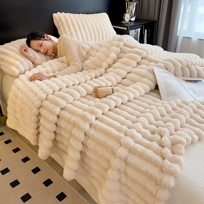 Lady in bed wrapped in Faux Rabbit Fur Throw Blanket