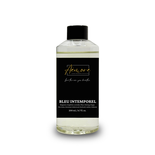 Bottle of 'Aémore Diffuser Oil Refill Bleu Intemporel' with black label on a white background