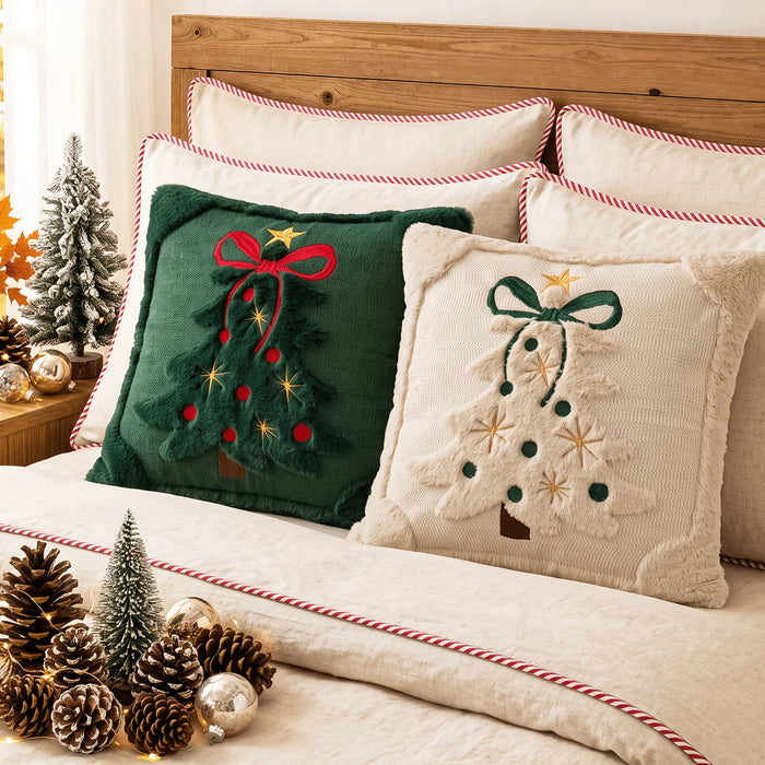 Green and beige Christmas tree cushions on a bed
