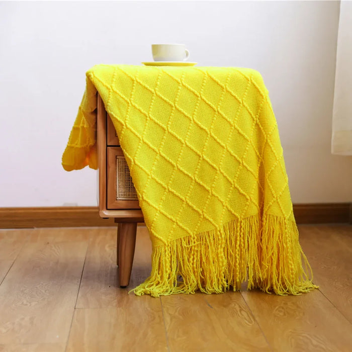 Yellow diamond knit throw over a wooden chair