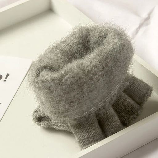 Inside of a light grey knit glove showing the thick knit