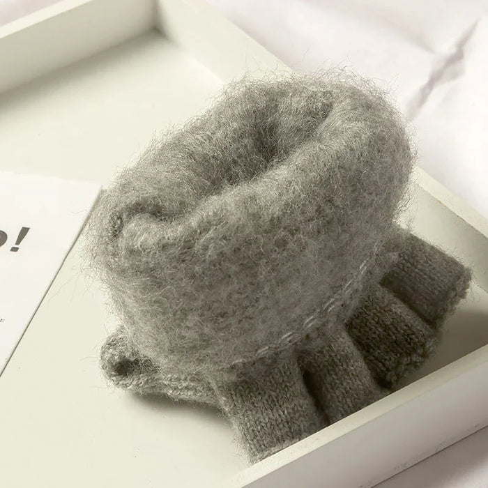 Inside of a light grey knit glove showing the thick knit