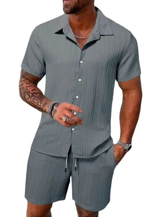 Man in a grey textured short sleeve shirt and shorts set