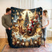 Couple holding up a large Santa sleigh Christmas blanket