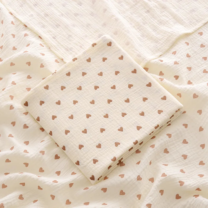 Muslin swaddle blanket with love heart print