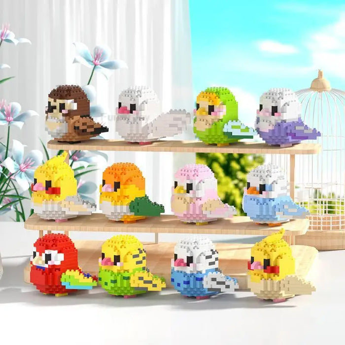 Twelve bird micro block figures on a white shelf