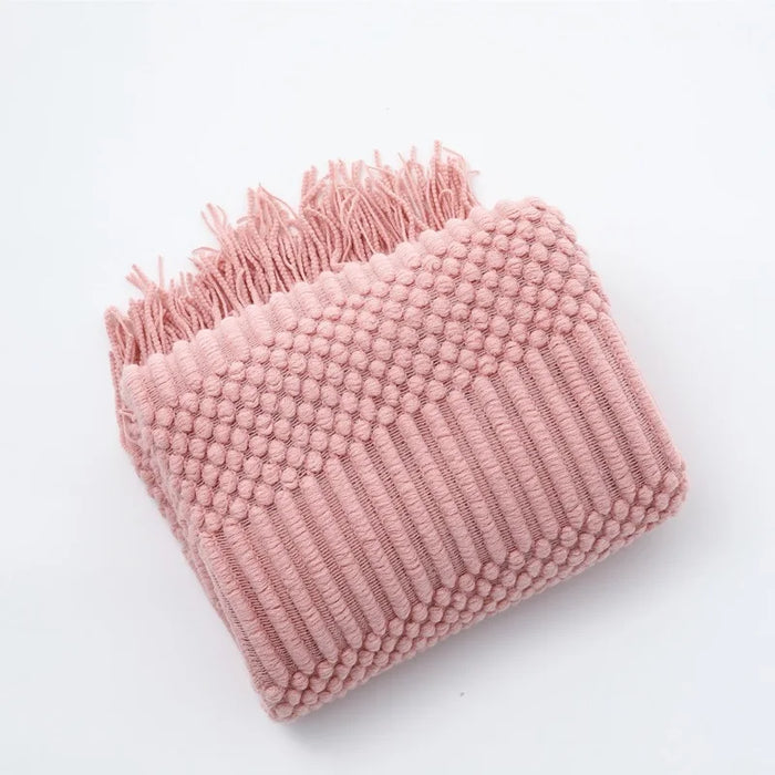 Folded pink bubble knit throw