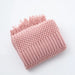 Folded pink bubble knit throw