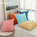 Corduroy cushions in pink, orange, blue and yellow