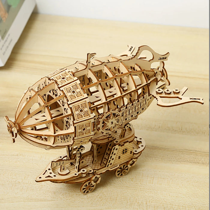 3D wooden airship model kit, assembled, on a wooden table