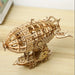 3D wooden airship model kit, assembled, on a wooden table