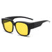 Black fit-over sunglasses with yellow lenses, side view