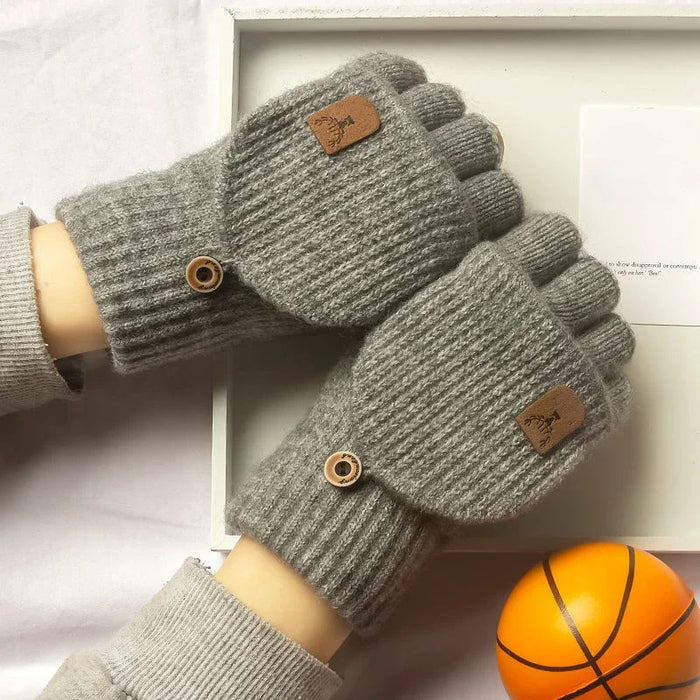 Pair of light grey fingerless gloves with the flaps buttoned back