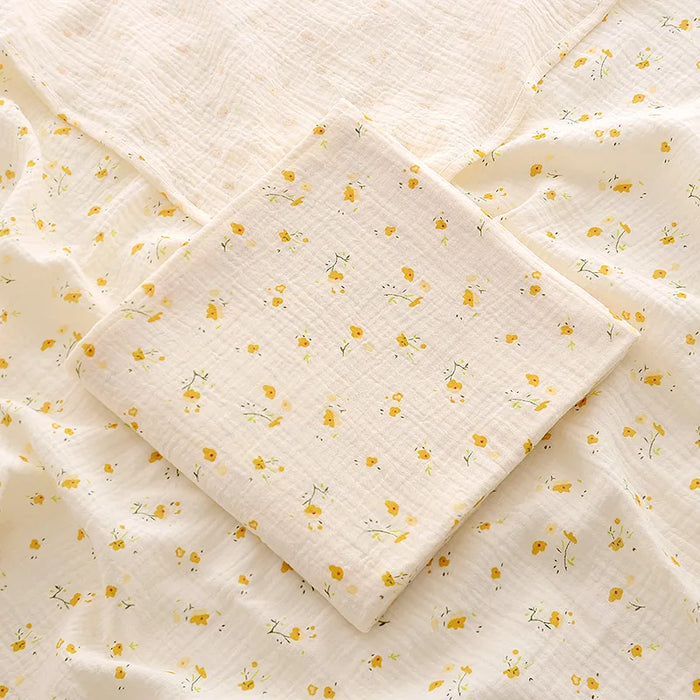 Muslin swaddle blanket with yellow flower print