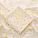 Muslin swaddle blanket with yellow flower print