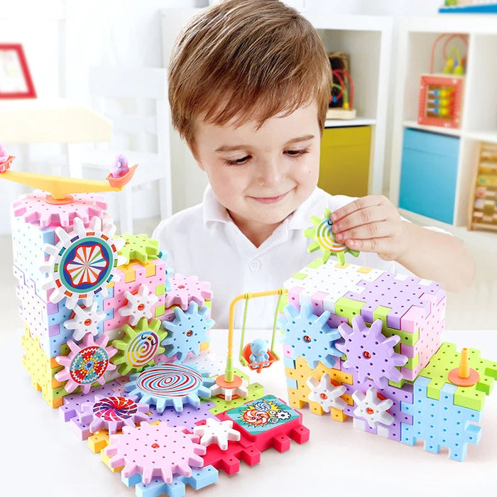 Child building with pastel electric gear blocks