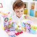 Child building with pastel electric gear blocks