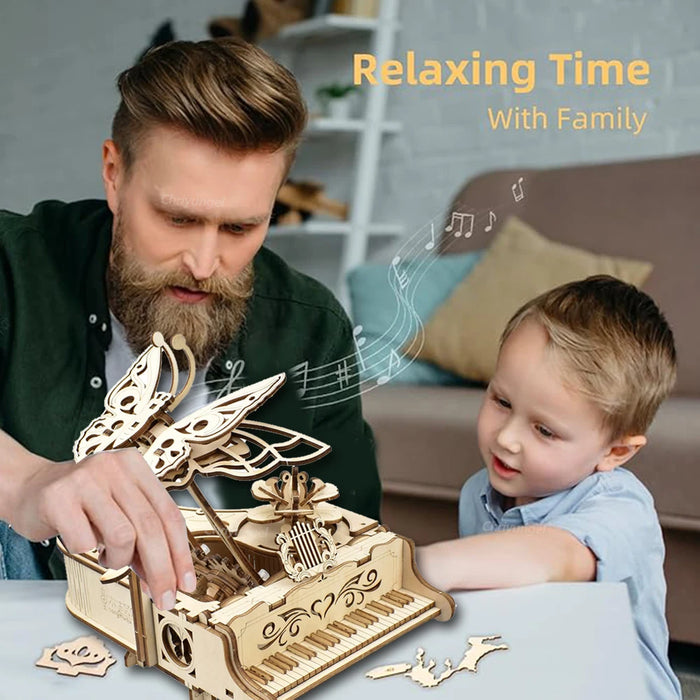 Father and child building the wooden piano music box together