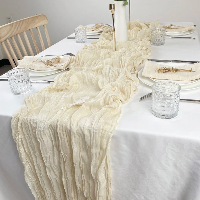 Cream gauze table runner on a dinner table