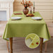 Matcha green linen-look tablecloth on a dining table