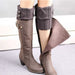 Grey knit boot cuff over a tall brown boot