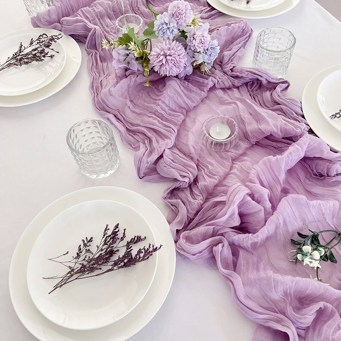 Purple gauze table runner with plates and lavender