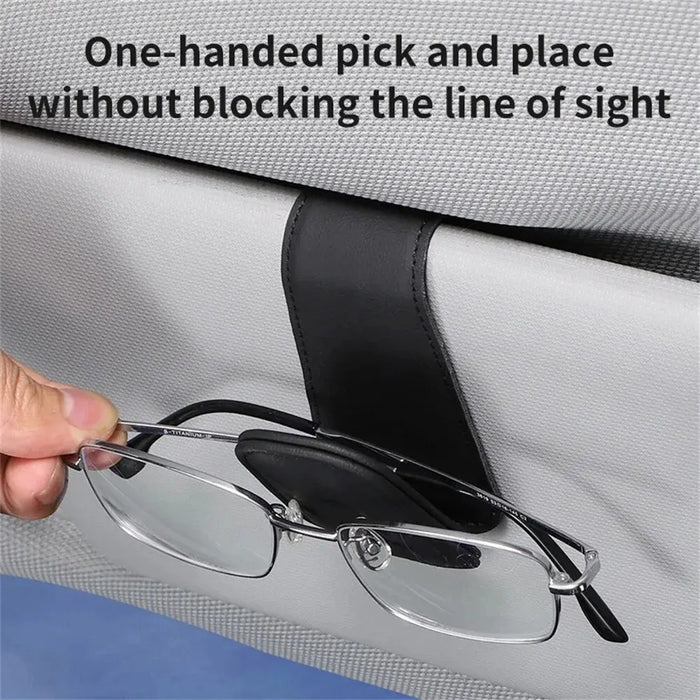 Hand taking glasses from a black visor holder