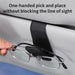 Hand taking glasses from a black visor holder