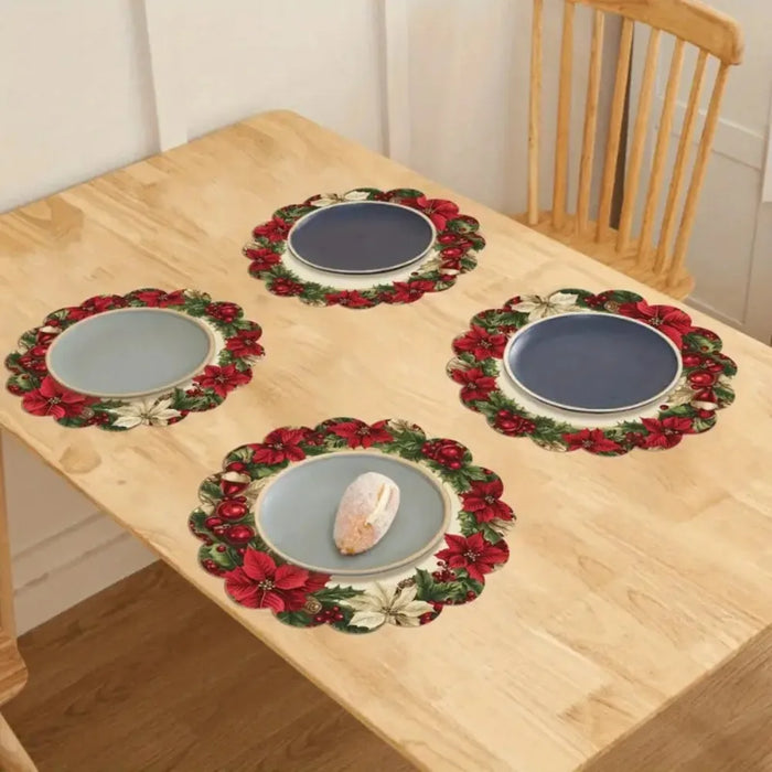 Red wreath placemats on a wooden table