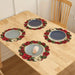 Red wreath placemats on a wooden table