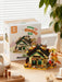 Autumn cabin building block set in front of its box