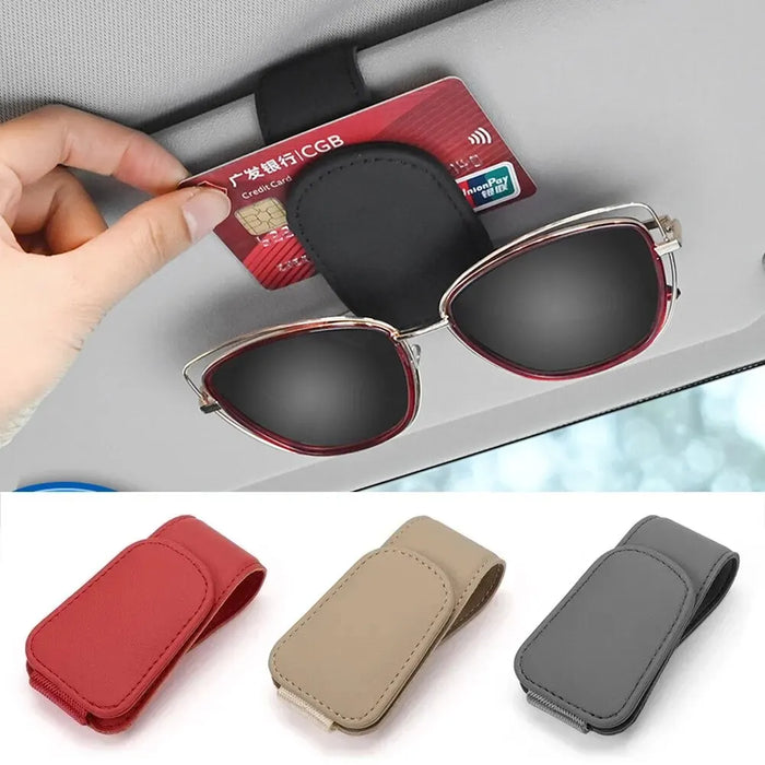 Card and sunglasses held by a visor holder, with red, beige and grey clips below