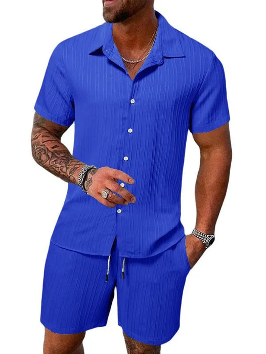Man in a royal blue short sleeve shirt and shorts set