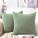 Bean green corduroy cushions on a sofa