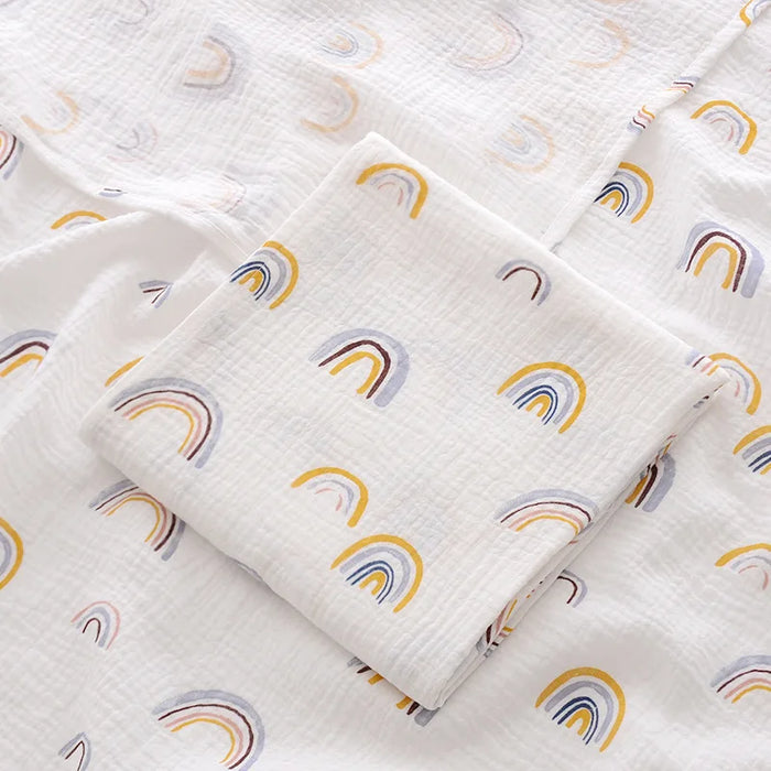 Muslin swaddle blanket with rainbow print