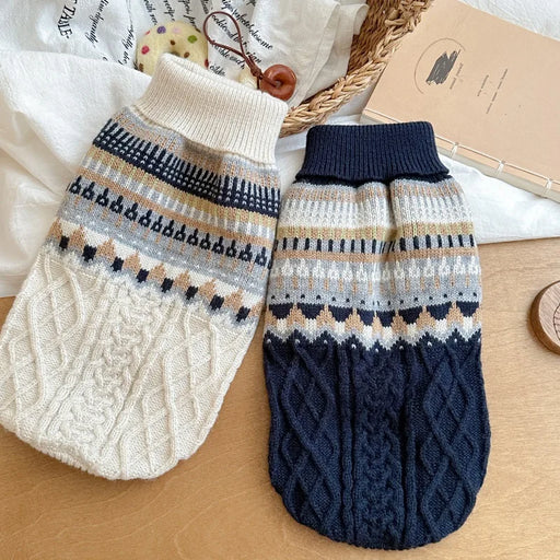 Cream and navy vintage knit dog sweaters laid flat