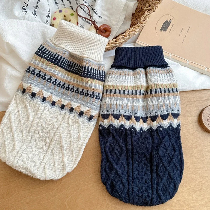 Cream and navy vintage knit dog sweaters laid flat