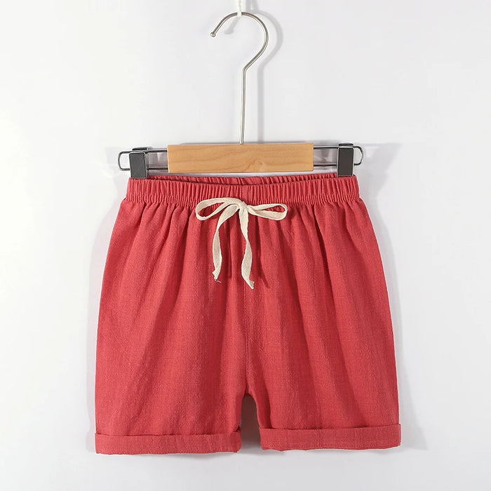 Dark red kids' cotton linen shorts on a hanger