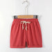 Dark red kids' cotton linen shorts on a hanger