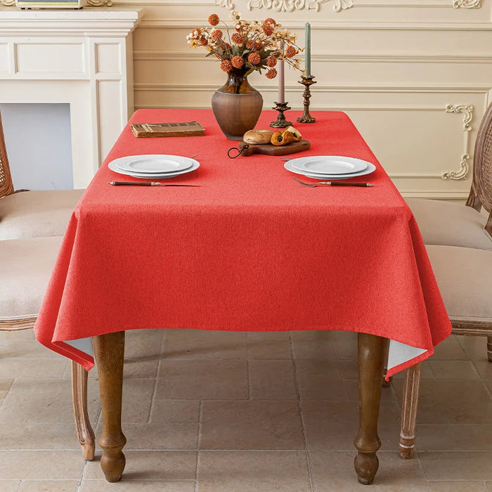Big red linen-look tablecloth on a dining table