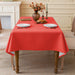 Big red linen-look tablecloth on a dining table
