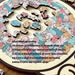 Close-up of pastel cat-shaped puzzle pieces with a short text about the puzzle