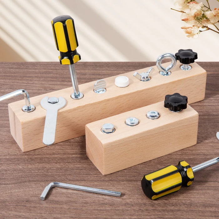 Two wooden screw boards with yellow screwdriver, wrench and hex key