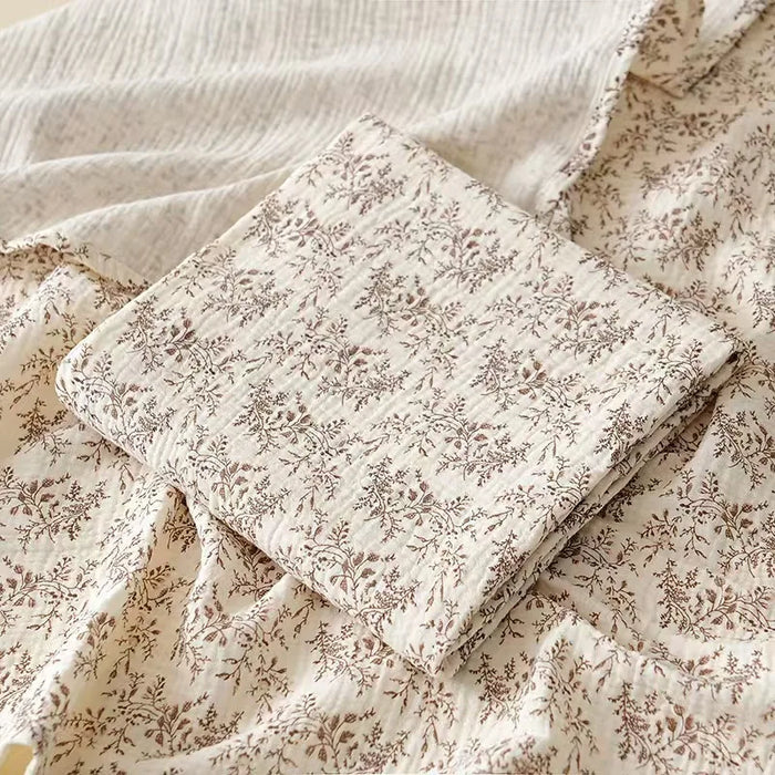 Muslin swaddle blanket with leaf print