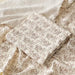 Muslin swaddle blanket with leaf print