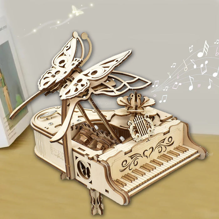 Assembled wooden piano music box with a butterfly on top