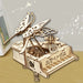 Assembled wooden piano music box with a butterfly on top