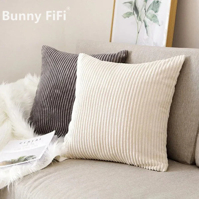 Beige and grey corduroy cushions on a sofa