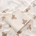 Folded cotton muslin swaddle blanket with teddy bear print