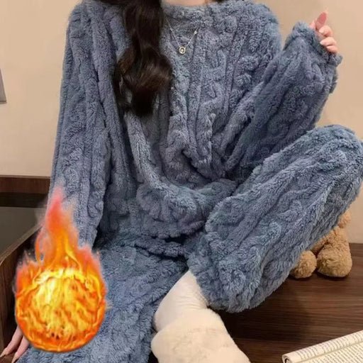 Woman in a blue cable-knit coral fleece pyjama set